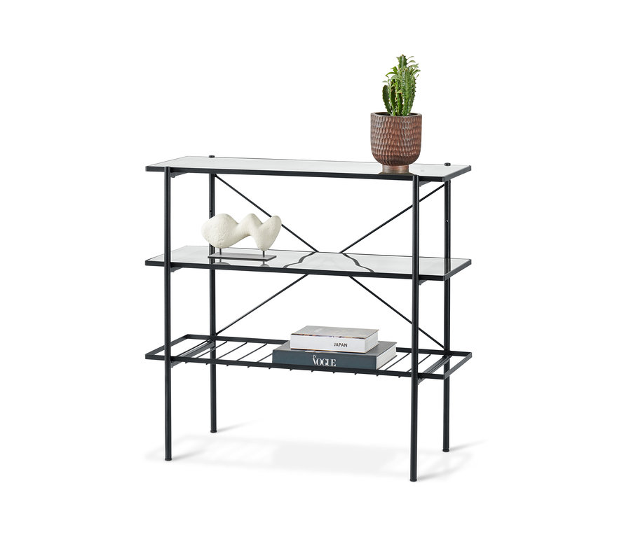 Console noire, largeur env. 90 cm, avec étagères en verre et décorations.