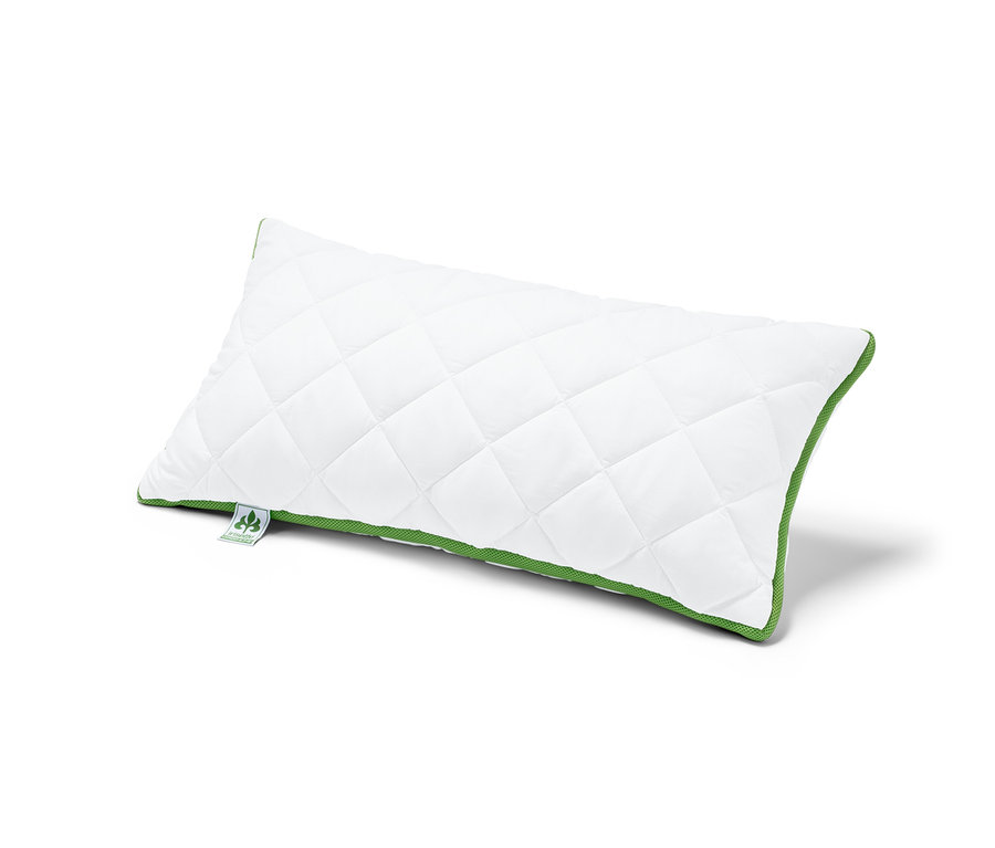 Un coussin blanc matelassé irisette® greenline à bande thermorégulatrice est posé sur un fond blanc.