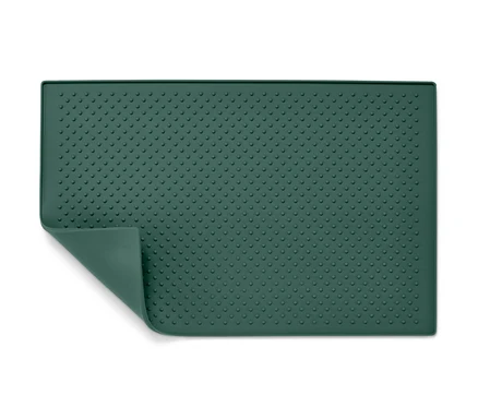 Un dessous de gamelle vert texturé.