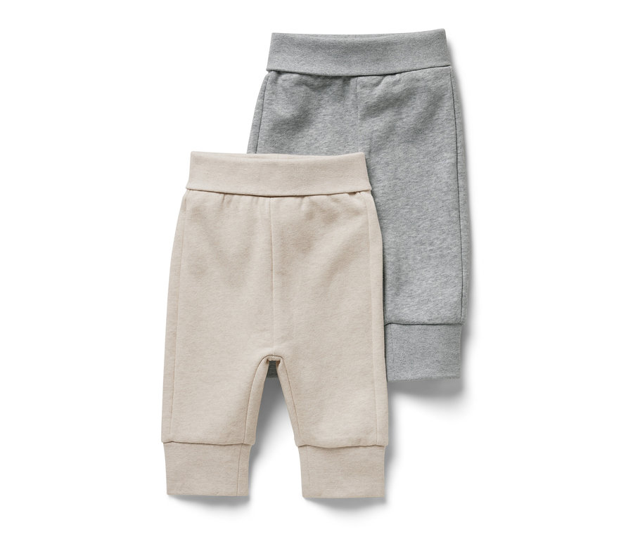 Deux sweatshirts pour bébé avec intérieur gratté, un beige et un gris.