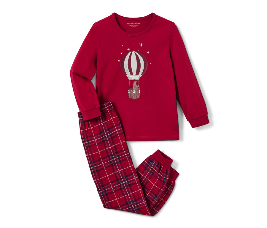 Un pyjama pour enfant « ballon », glow in the dark, est présenté sur l'image. Le pyjama est rouge et comporte un motif de montgolfière.