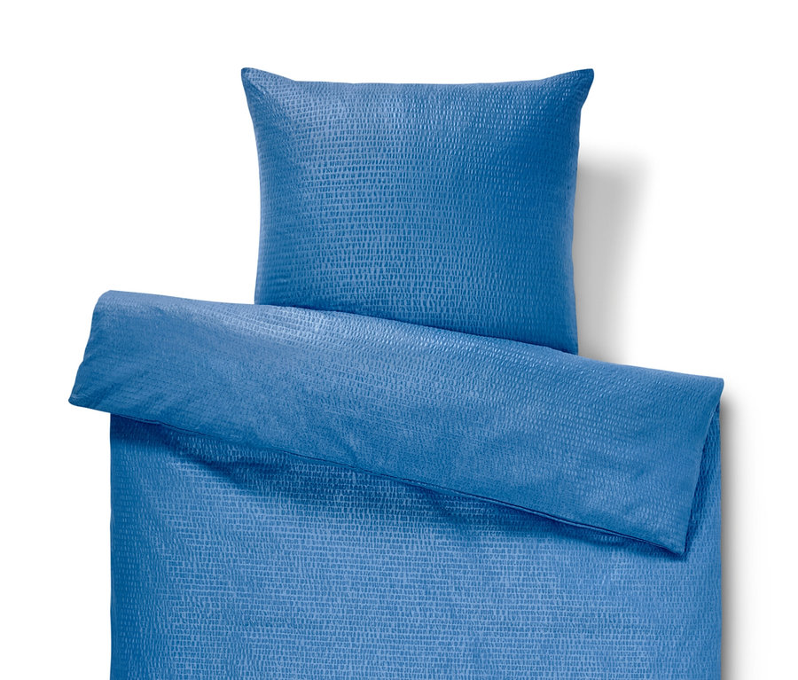 Parure de lit en seersucker bleue taille normale avec oreiller.