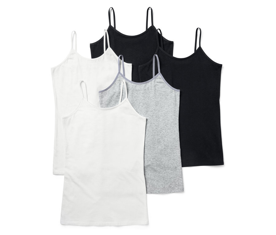 Cinq débardeurs en blanc, gris et noir. Les débardeurs ont de fines bretelles.