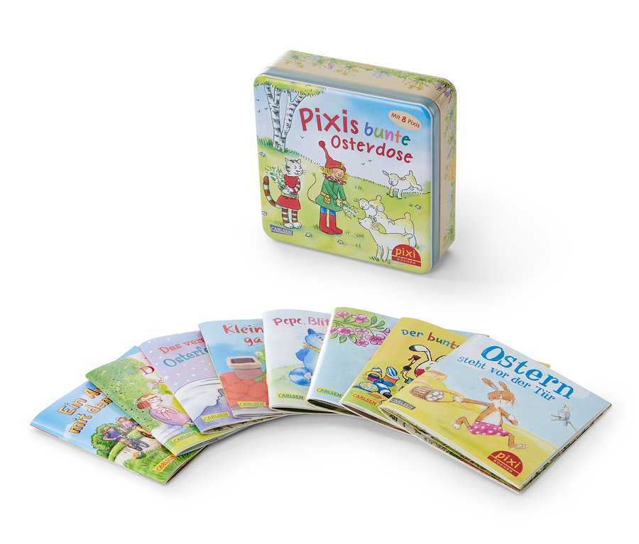 Une boîte métallique Pixis bunte Osterdose et plusieurs livres Pixi disposés en rangée.