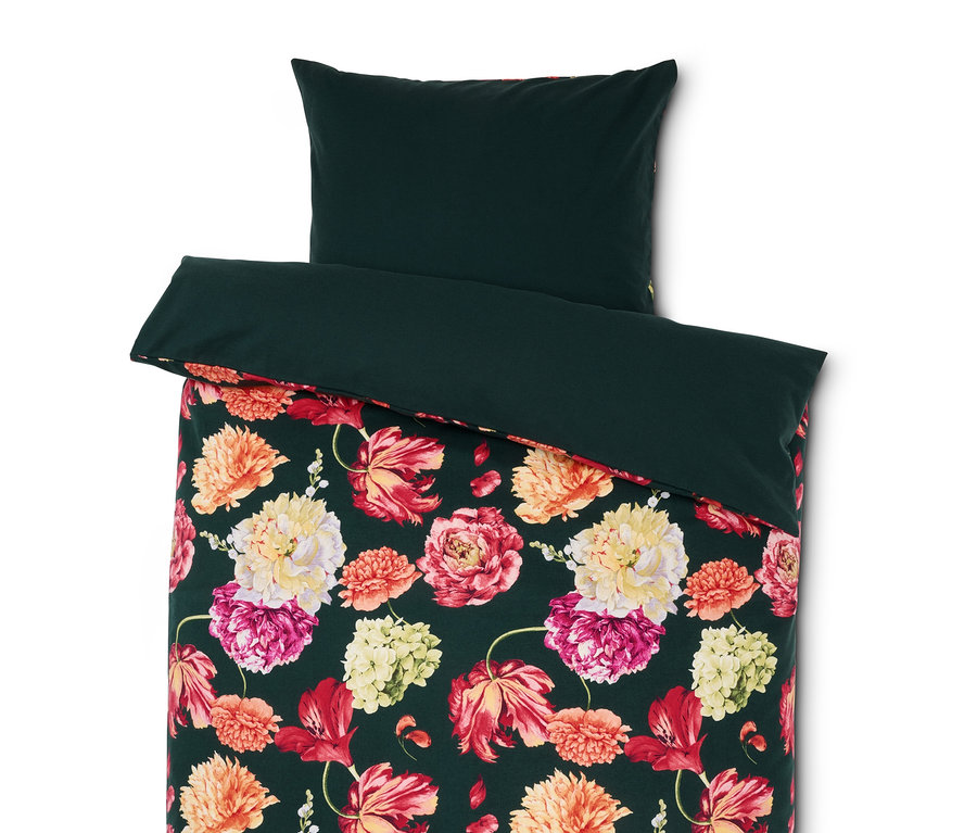 Linge de lit vert avec motif floral.