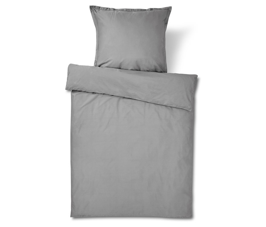 Linge de lit gris avec taie d'oreiller et housse de couette.
