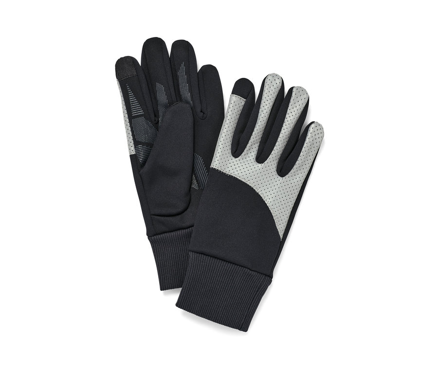 Deux gants noirs coupe-vent avec parementure réfléchissante sont posés l'un à côté de l'autre.