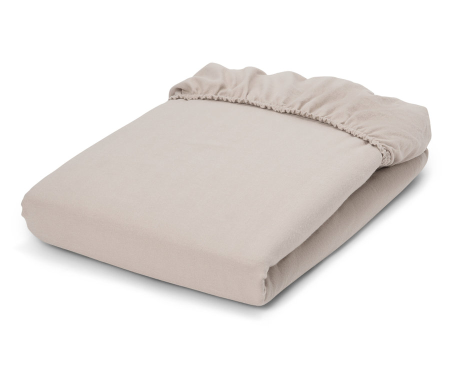 Drap-housse beige plié.