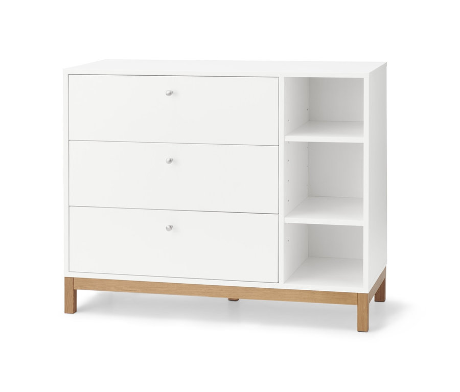 Commode blanche avec trois tiroirs et étagères ouvertes.