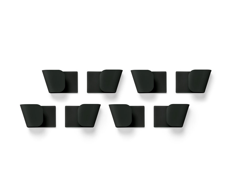 Huit supports muraux noirs pour couvercles, 4 unités, disposés sur deux rangées sur un fond blanc.