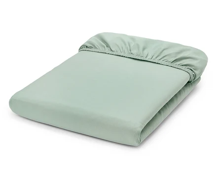 Drap-housse vert clair plié.