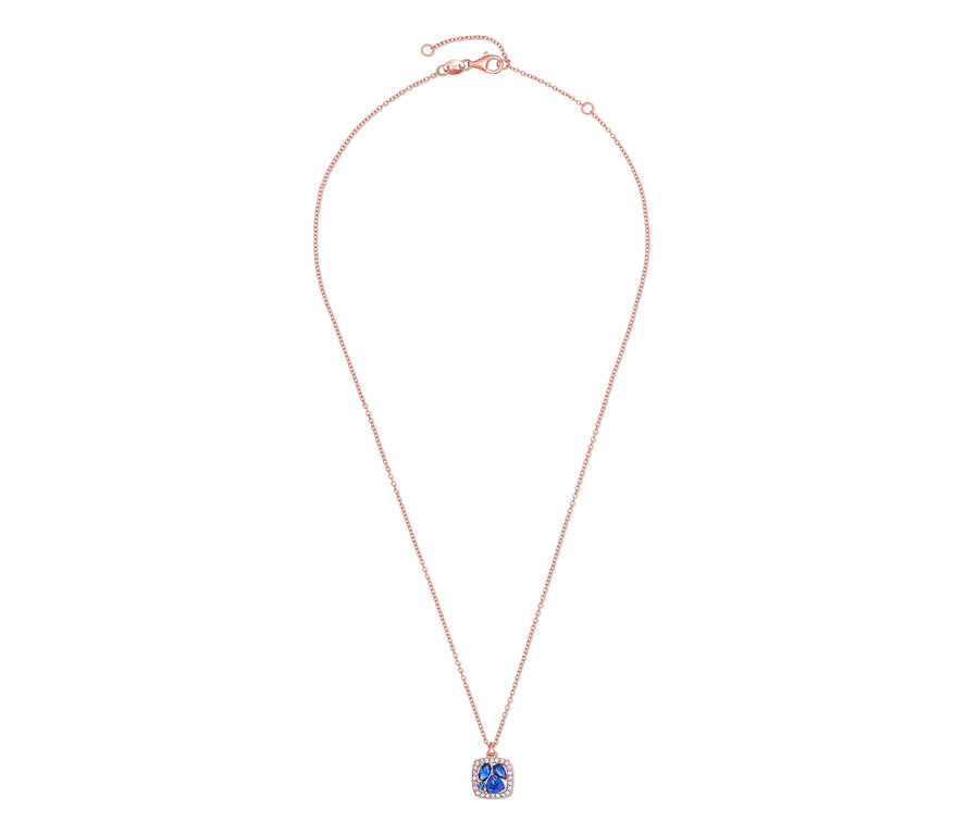 Collier avec chaîne en or rose et pendentif bleu.
