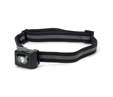 Lampe frontale avec boîtier noir et sangle à rayures grises.