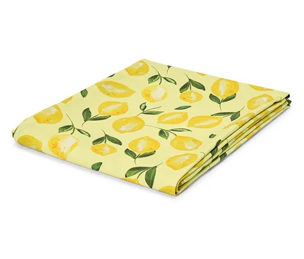 Tissu jaune plié avec motif citron.