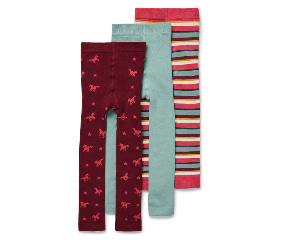 Trois leggings pour enfants : bordeaux avec des étoiles et des chevaux, bleu clair et rayé.