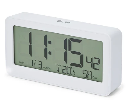 Réveil radio-piloté LCD blanc avec affichage numérique de 11h15, la date 1/3 et la température 20,5°C.