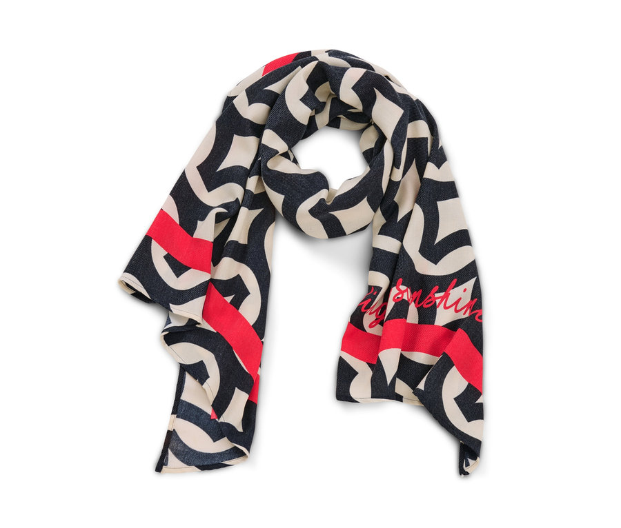 Vue détaillée d'une écharpe tissée imprimée en crème, bleu marine et rouge.