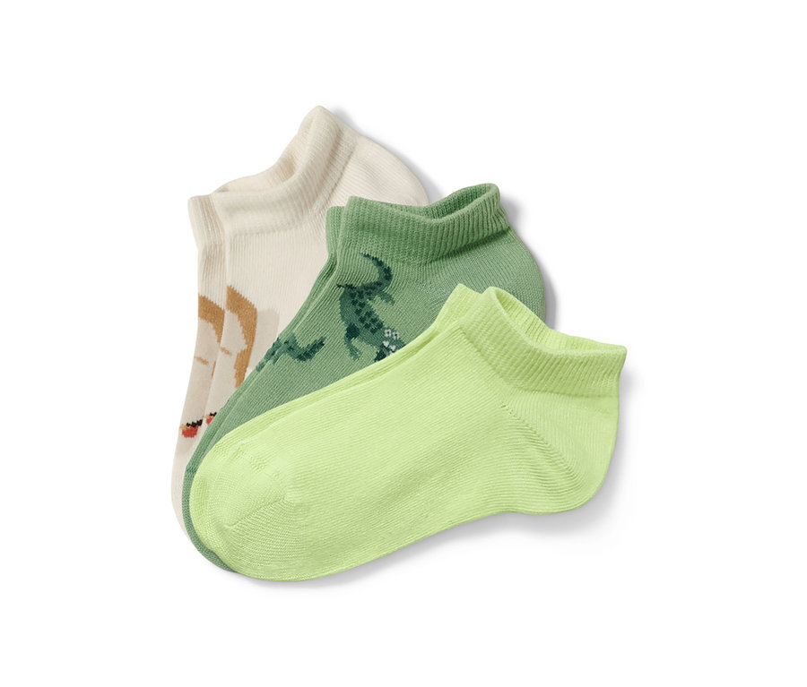 Trois paires de socquettes de sport pour enfant avec des motifs d'animaux.