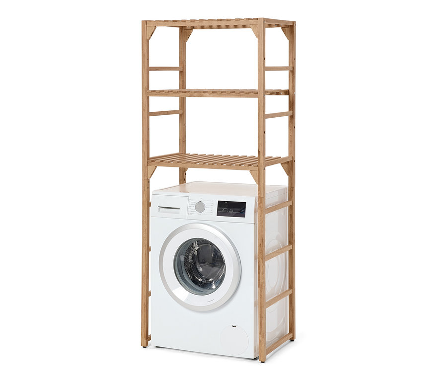 Un sèche-linge blanc est placé sous une étagère en bois massif pour machine à laver.