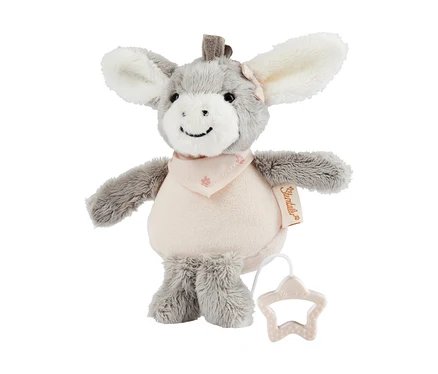 Boîte à musique en peluche âne grise et rose clair « Emmi l’âne Girl » avec un bandana rose, un petit nœud rose sur l'oreille et une poignée en étoile.