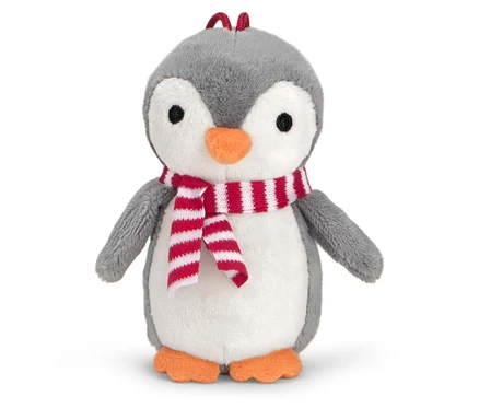 Un pingouin en peluche avec une écharpe rayée rouge et blanche.