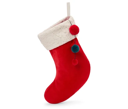 Une chaussette de Noël rouge avec une bordure blanche et des pompons décoratifs suspendue sur un fond blanc.