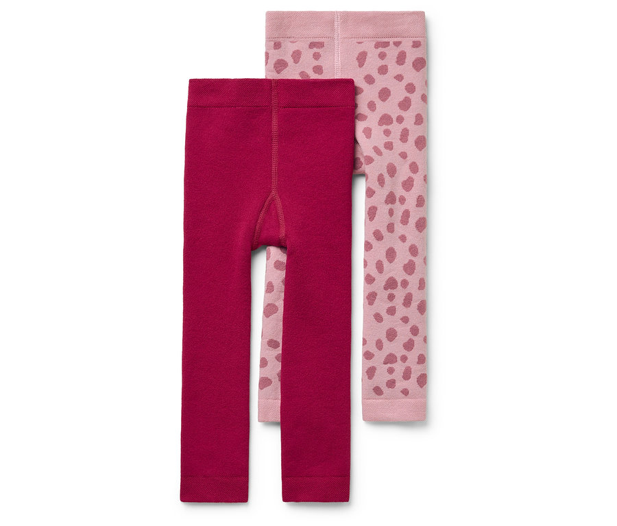 Deux paires de collants pour enfants : une bordeaux, l’autre rose clair avec un imprimé animal rose foncé.