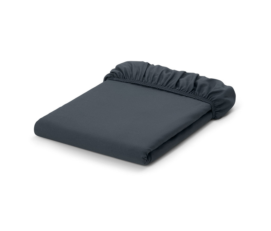 Drap-housse en microfibre gris plié.