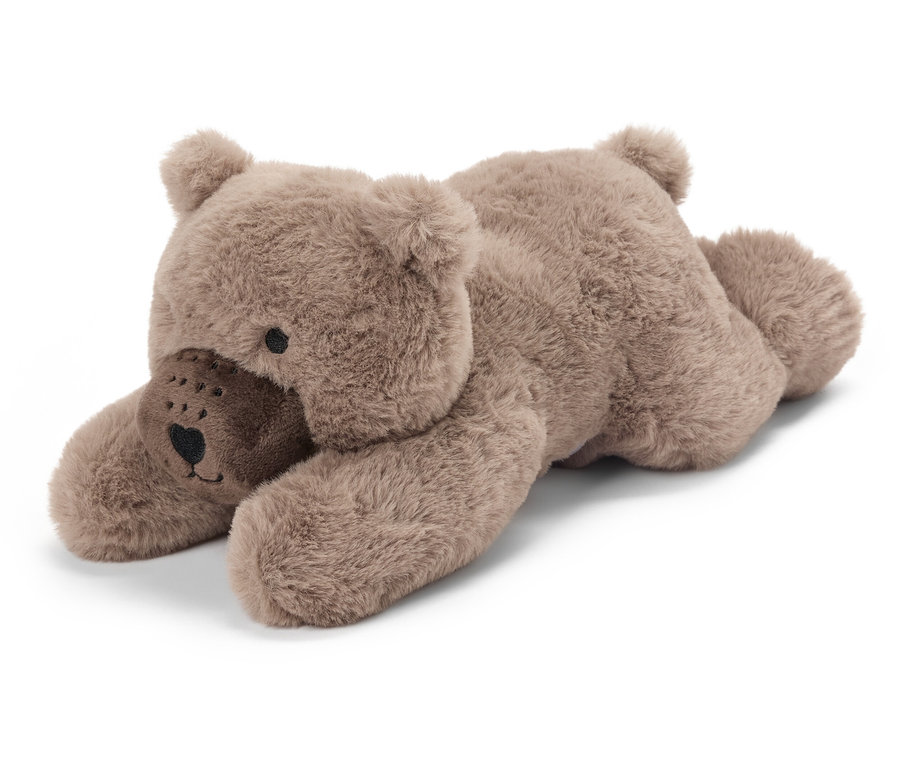 Un ours en peluche brun allongé.