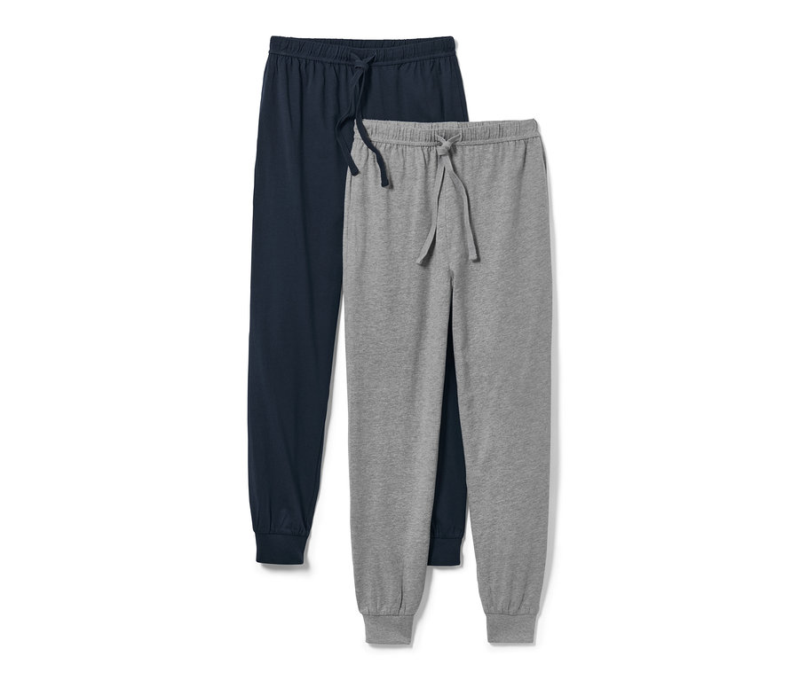 Deux pantalons de pyjama : un bleu marine et un gris.