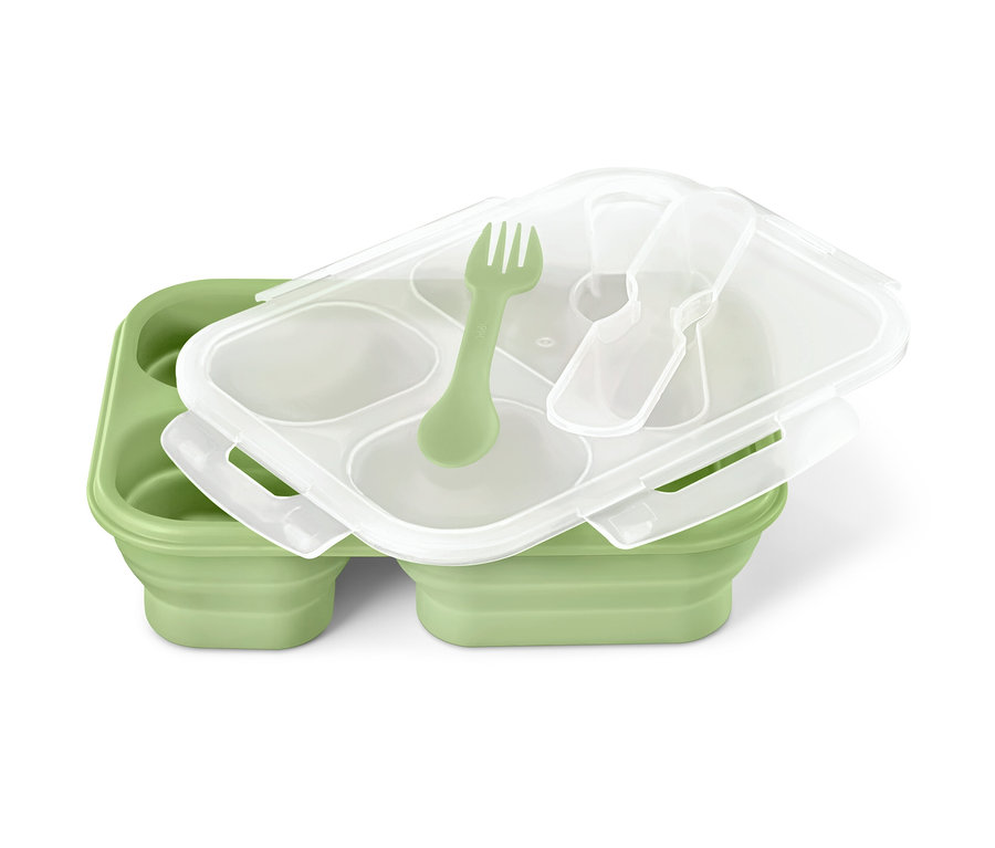 Une boîte repas pliable verte avec un couvercle transparent, une fourchette verte et une cuillère transparente.