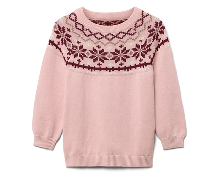 Pull rose avec motif de Noël.