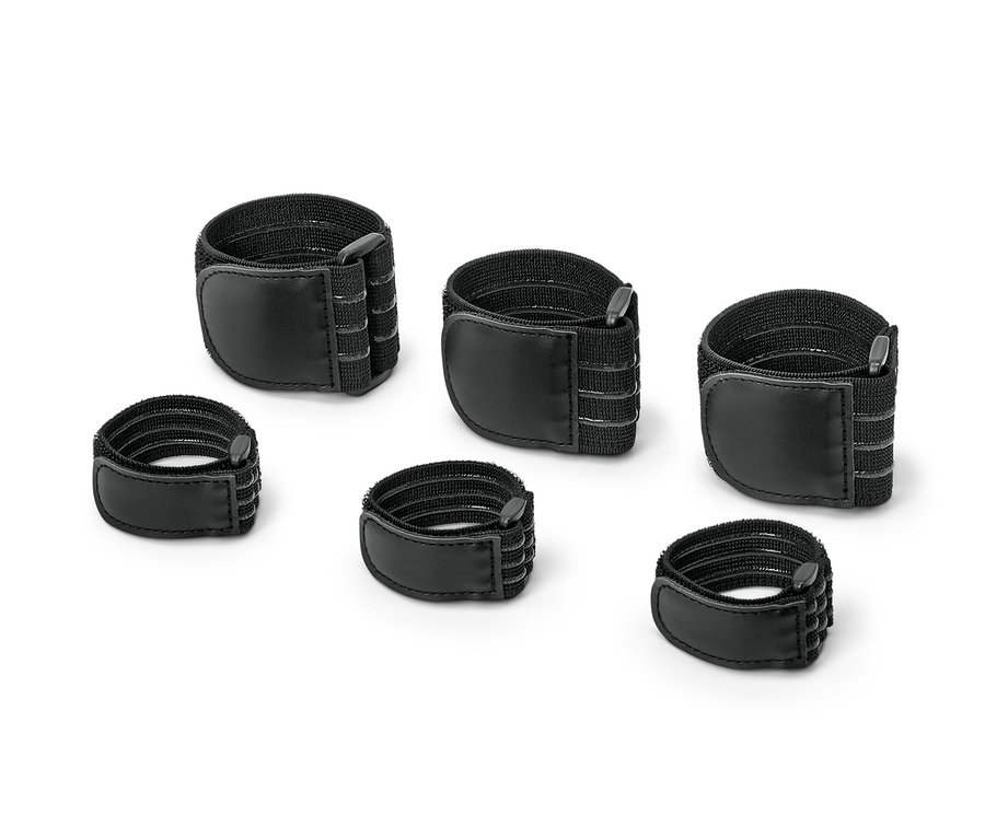 Six sangles de fixation élastiques noires sont posées sur un fond blanc.