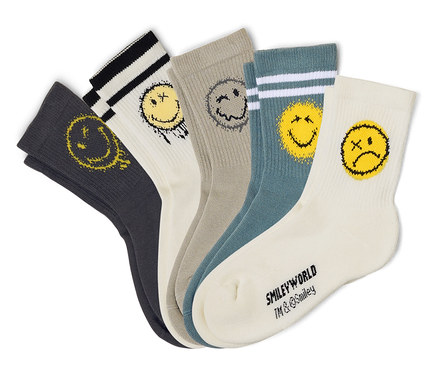 Cinq paires de chaussettes de tennis pour enfant SMILEYWORLD® en blanc, gris et pétrole, étalées en éventail. Chaque chaussette présente un motif de smiley jaune ou gris vieilli différent, certaines avec des bords-côtes rayés.