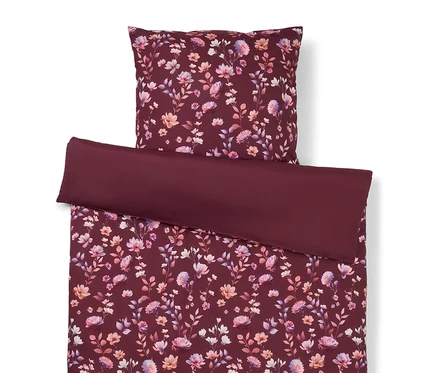 Ensemble de literie à motif floral bordeaux, comprenant une taie d'oreiller et une housse de couette.