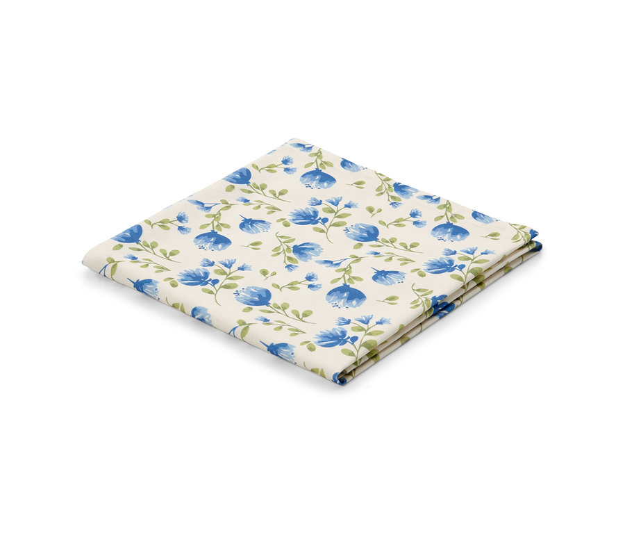 Nappe lavable pliée, env. 90 x 90 cm, avec motif floral bleu.