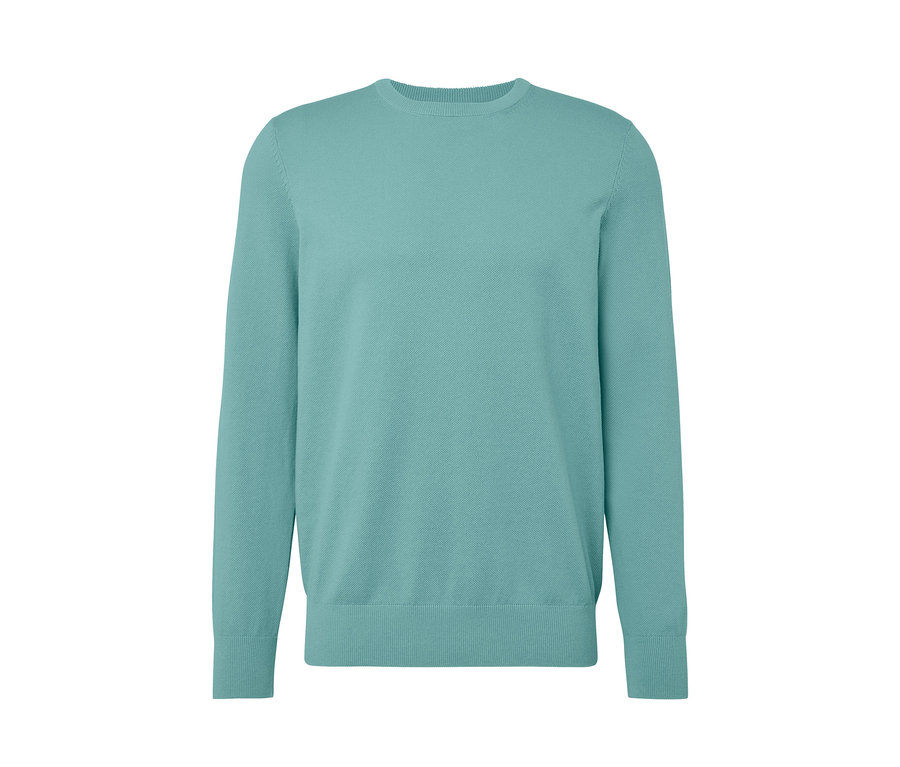 Pull en maille turquoise clair.