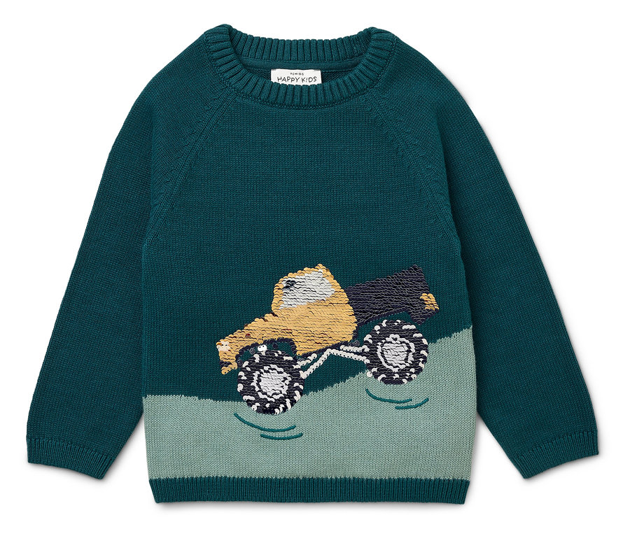 Pull vert avec un motif de camion jaune.