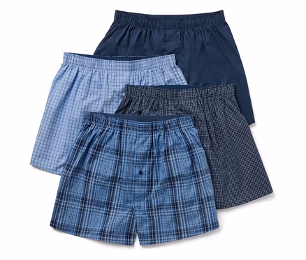 Quatre boxers pour hommes de différentes couleurs et motifs.