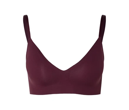 Soutien-gorge bordeaux à col en V et fines bretelles sur fond neutre.