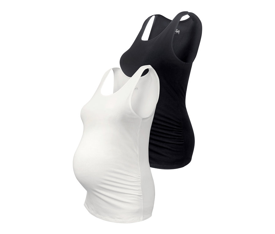 Deux hauts de grossesse, un blanc et un noir.