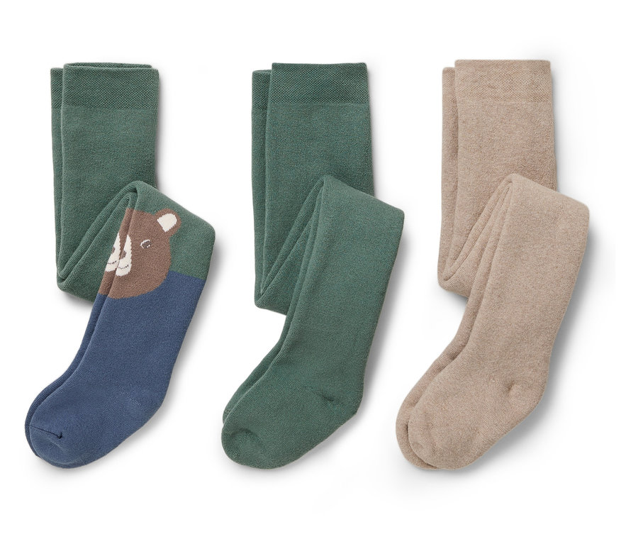 Trois paires de collants pour enfants : une avec un ours brun sur fond bleu, une verte et une beige.