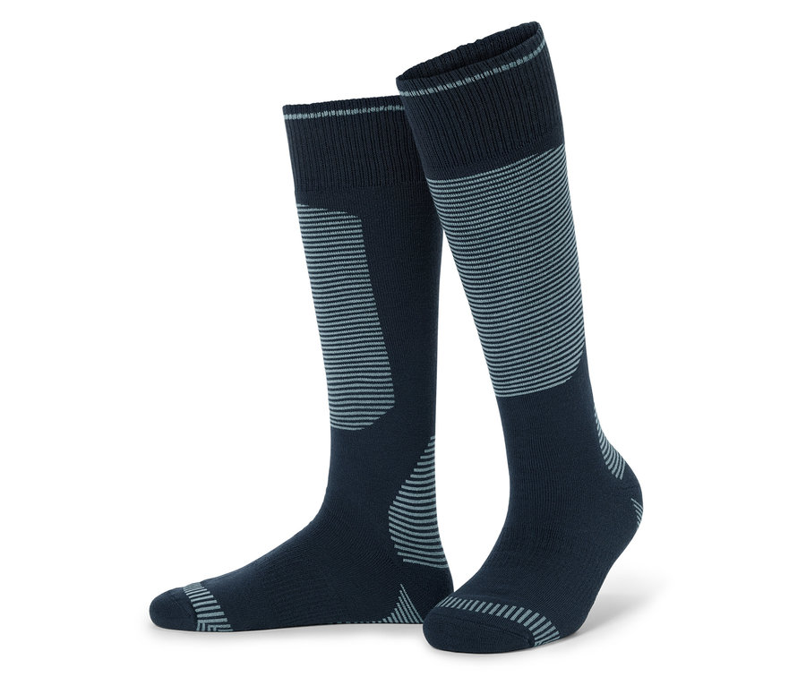 Une paire de chaussettes hautes bleu marine avec des rayures grises.