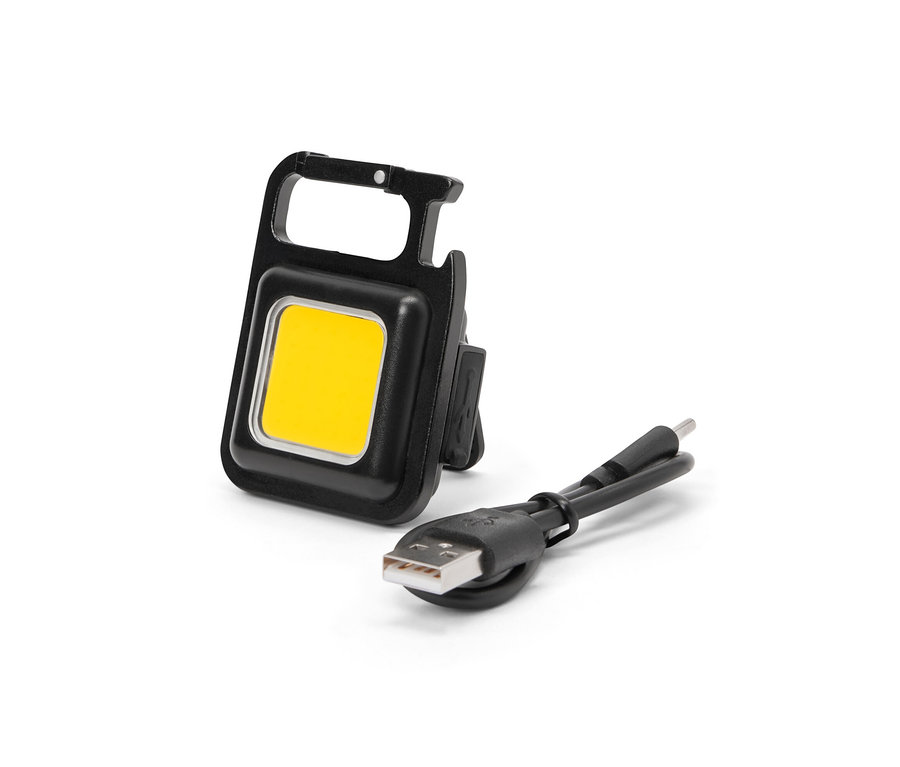 Lampe multifonction noire avec câble de chargement.