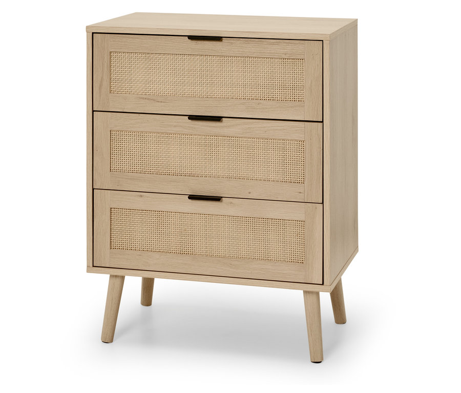Commode claire avec trois tiroirs à façade en rotin.