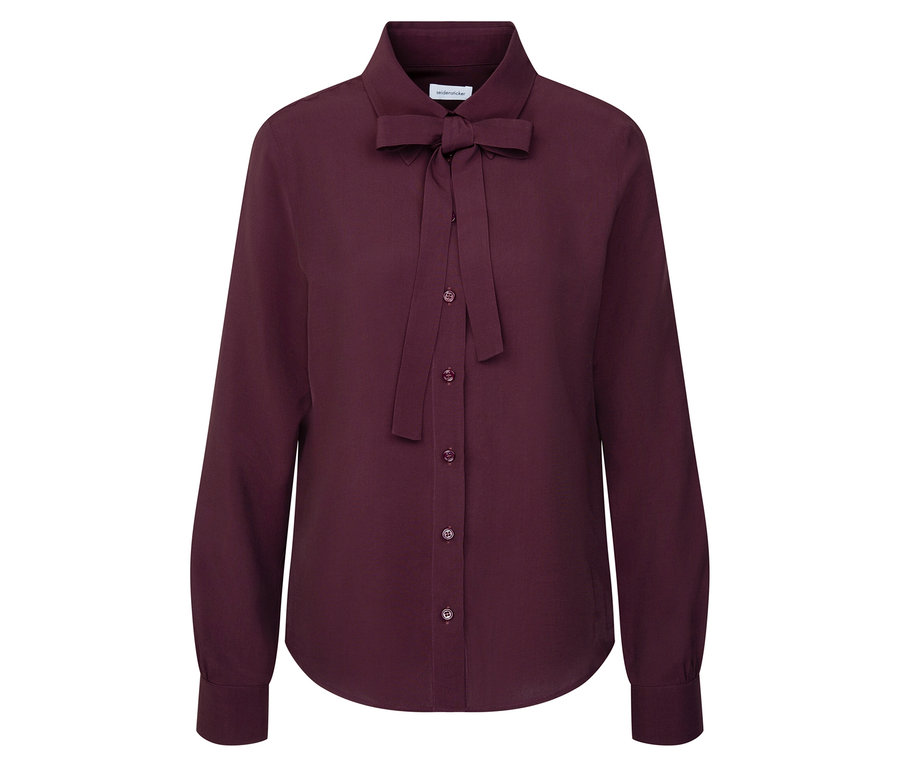 Une blouse bordeaux à manches longues avec un nœud.