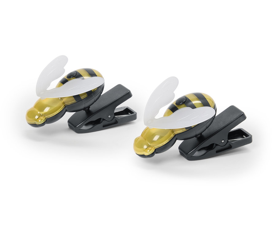 Deux lampes à pince en forme d'abeilles posées sur un fond blanc.