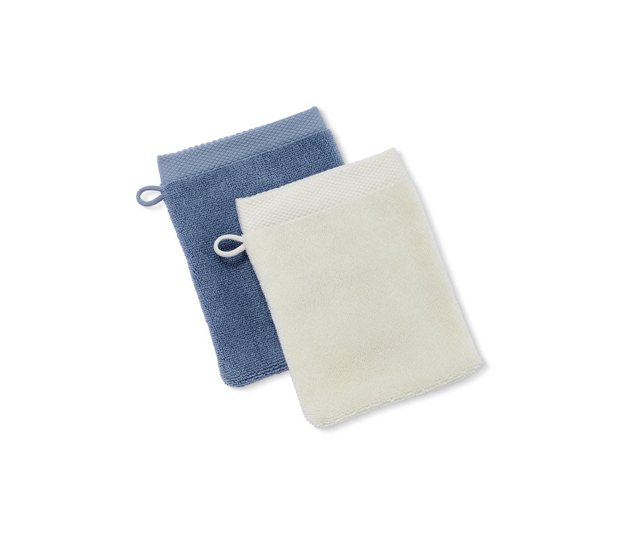 Deux gants de toilette de haute qualité, bleu et blanc.