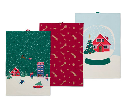 Trois linges de cuisine avec des motifs de Noël.