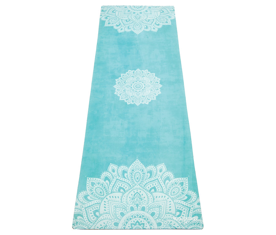 Tapis de yoga turquoise avec motif mandala blanc.